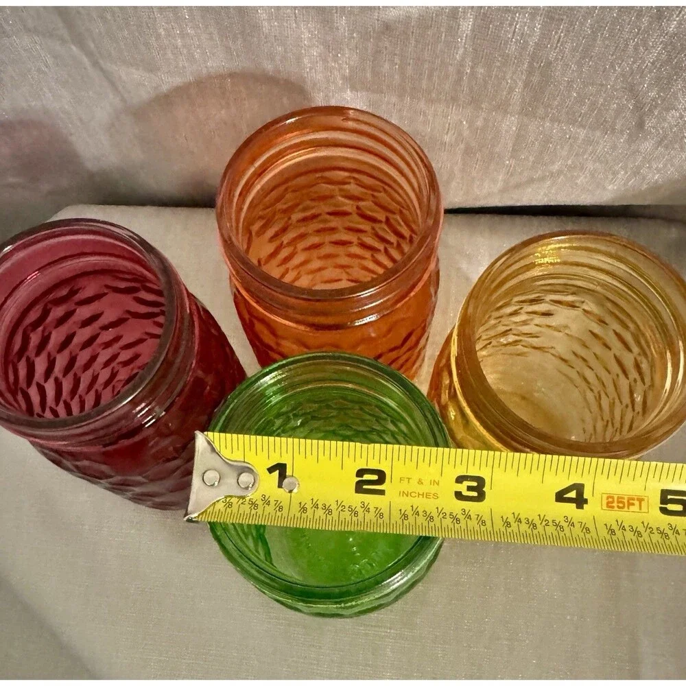 Set of 4 modern, colorful glass jars w/ hexagon stamped pattern